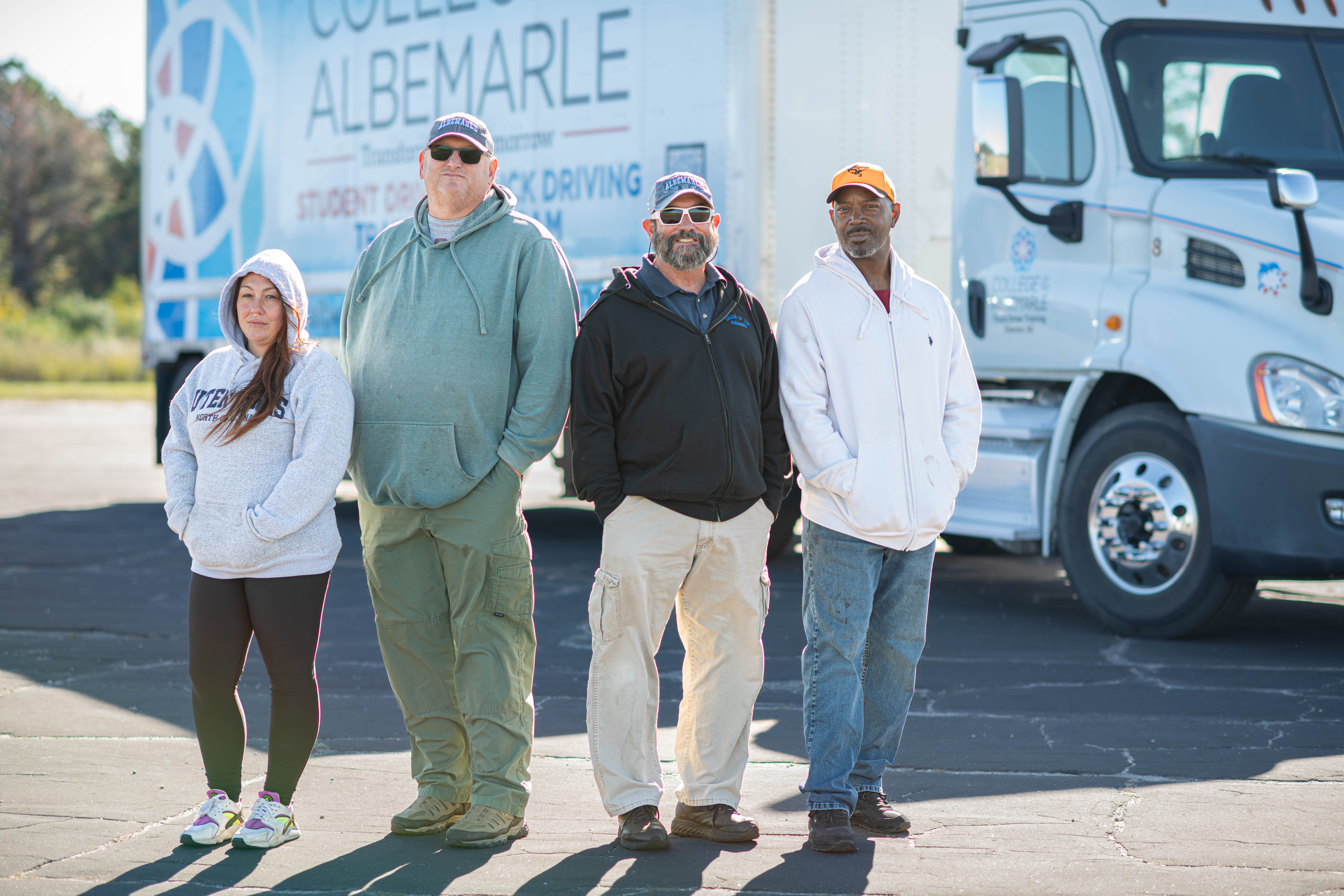 COA Truck Driving Class pictured behind a COA CDL truck.