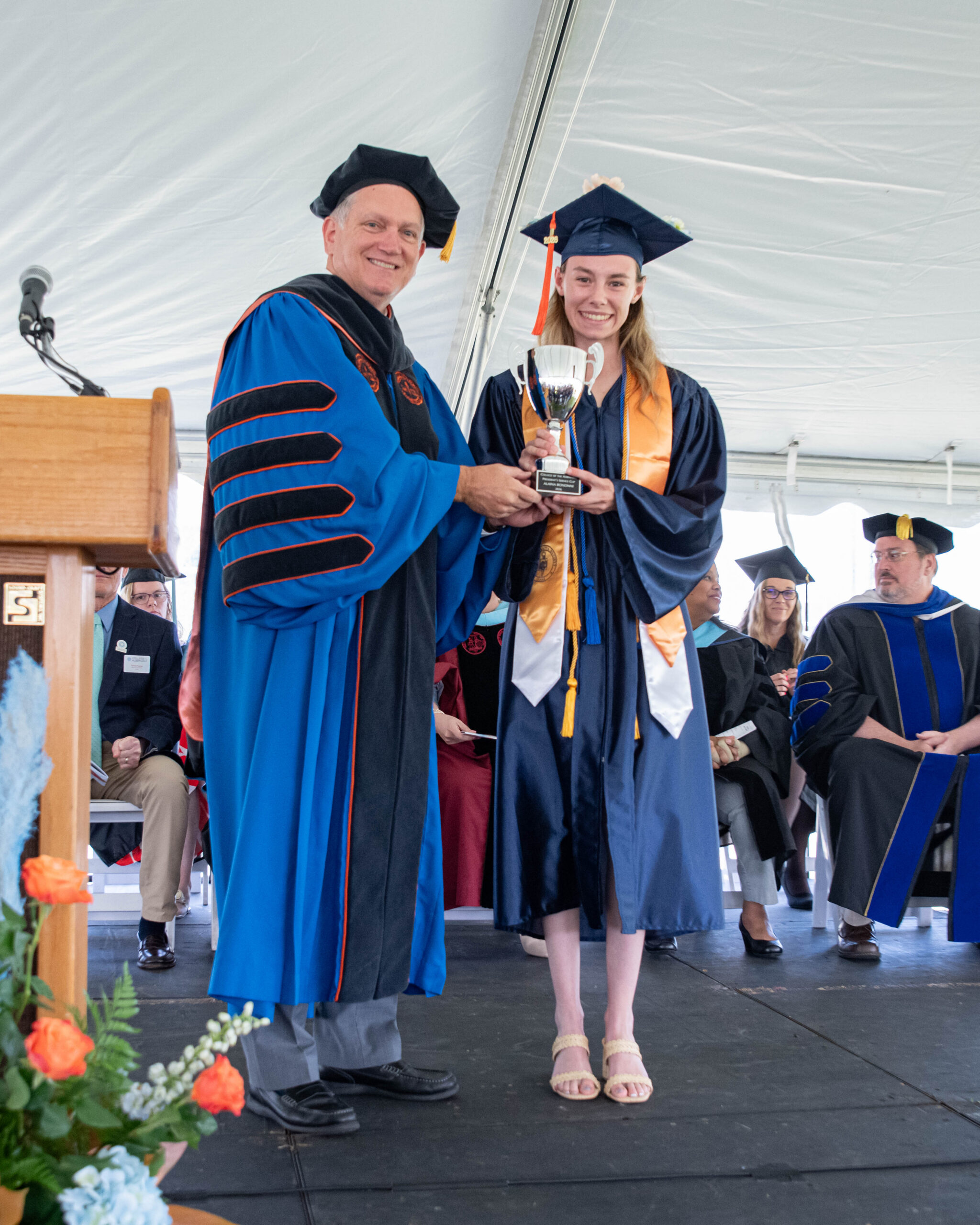 President Bagwell presents Alaina Bonanni with the President’s Service Cup for 2026 during the COA – Dare commencement