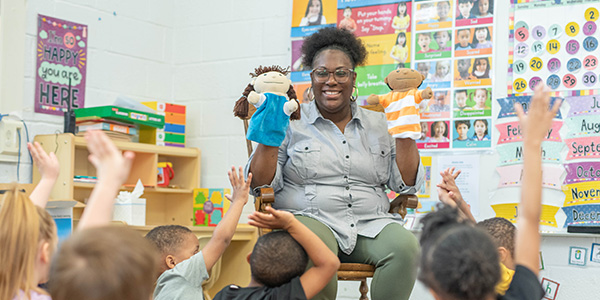 Early Childhood Education student teaching a class of children