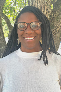 Jessica Buckley-Williams pictured smiling outside in front of a tree.